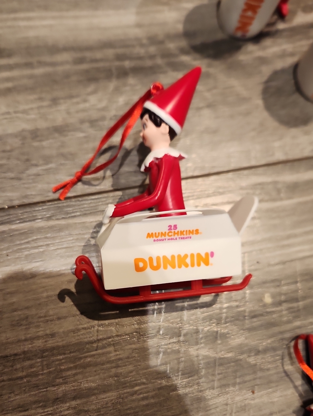 Dunkin' Red Elf on Sled Holiday Ornament